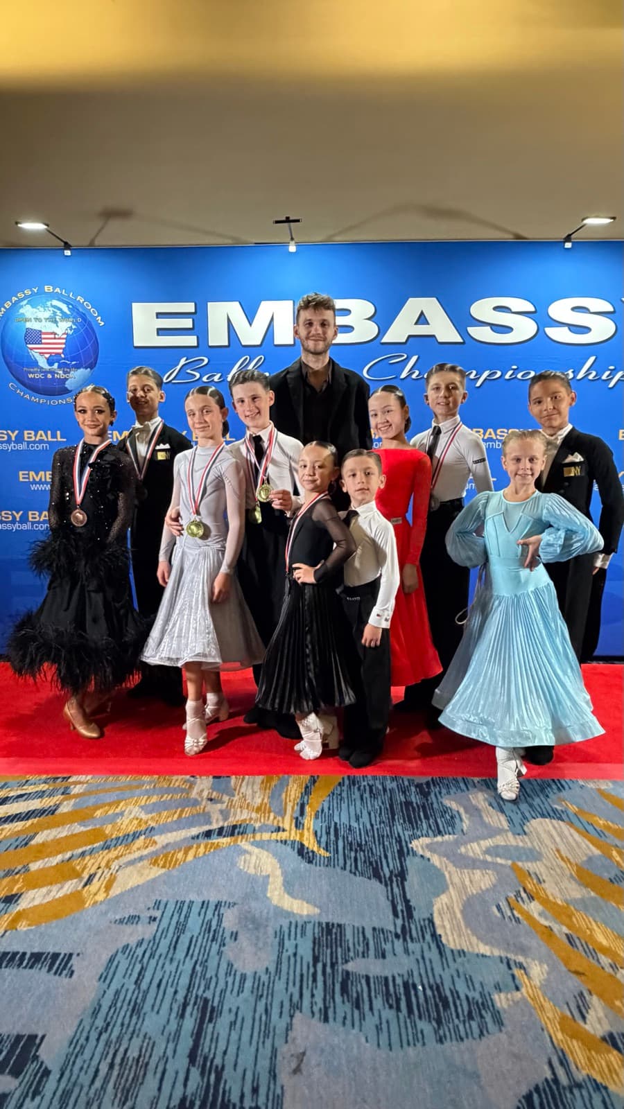 Junior competition team with their medals at the Embassy Ballroom Championships