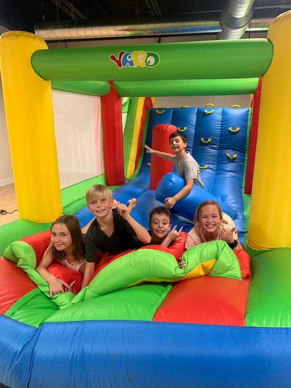 Kids playing on the bouncy castle add-on