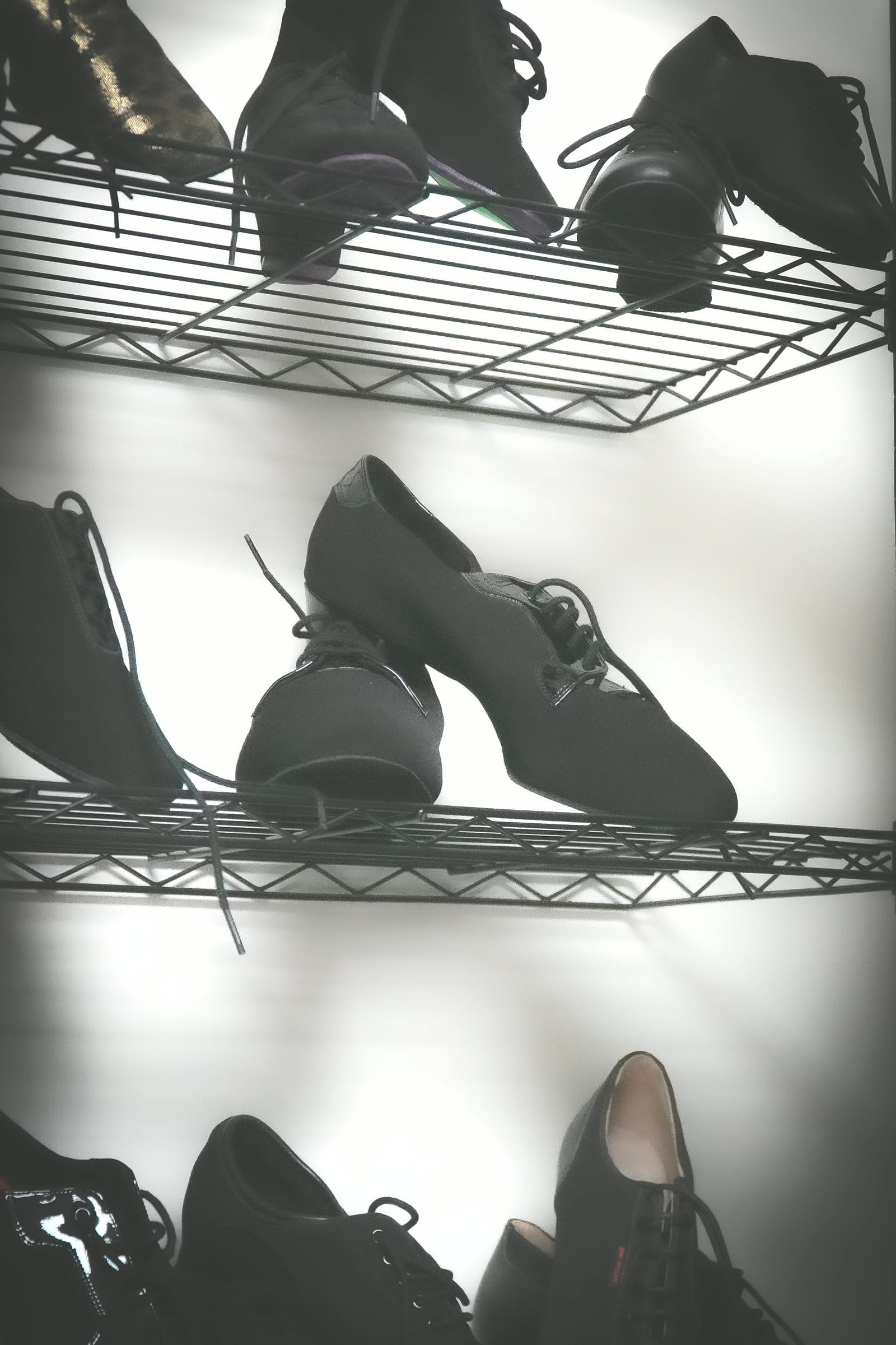 Black practice and competition shoes on display