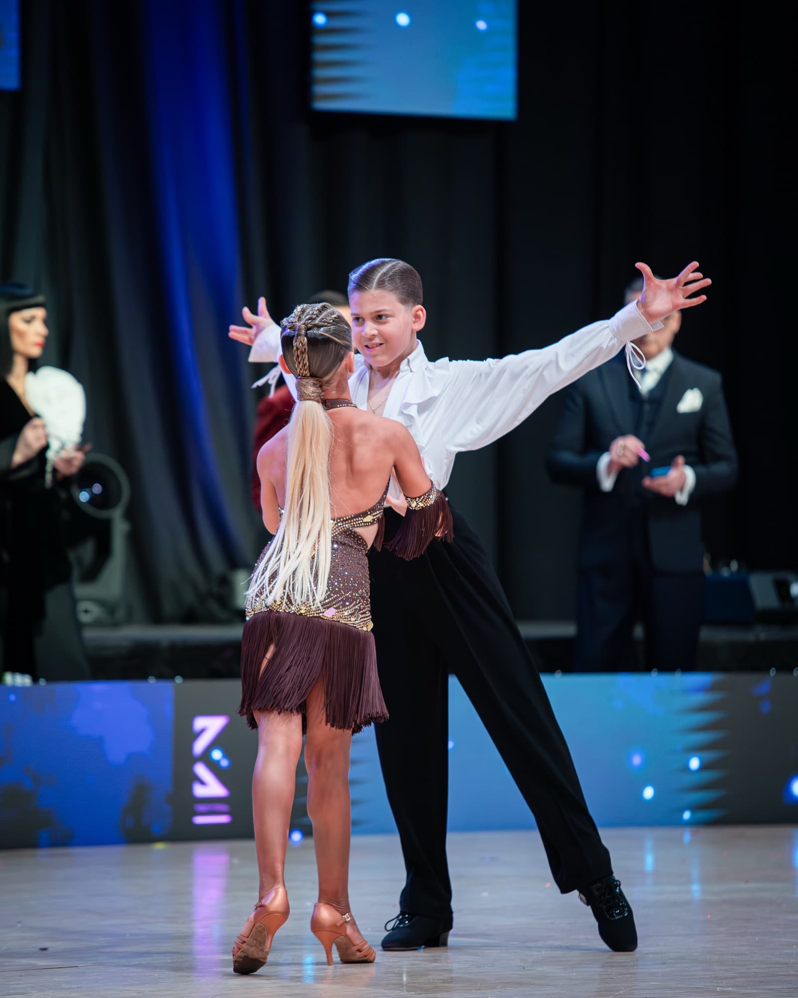 Junior competitive dancers in costume, mid-performance